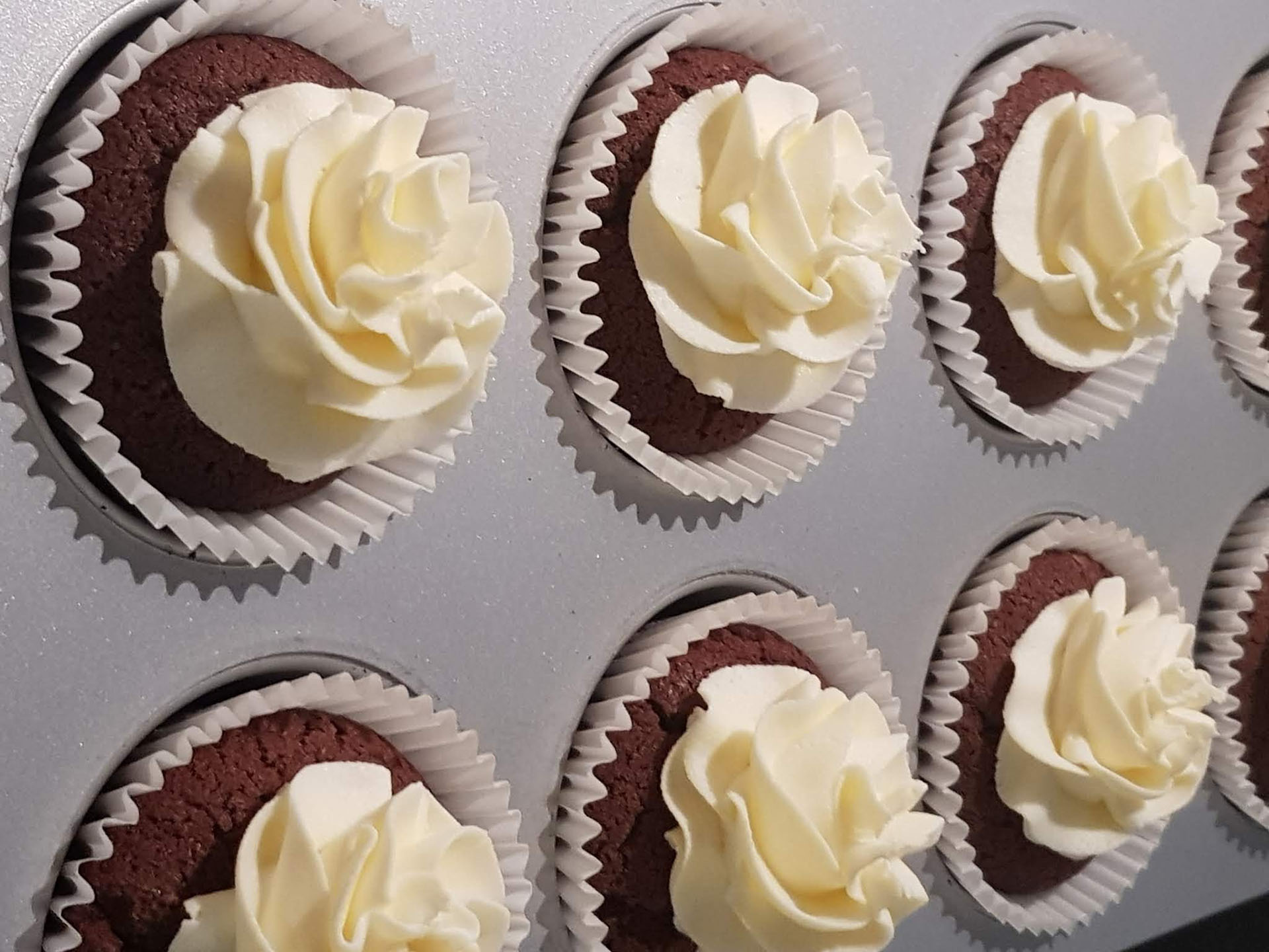 Tray of iced cupcakes