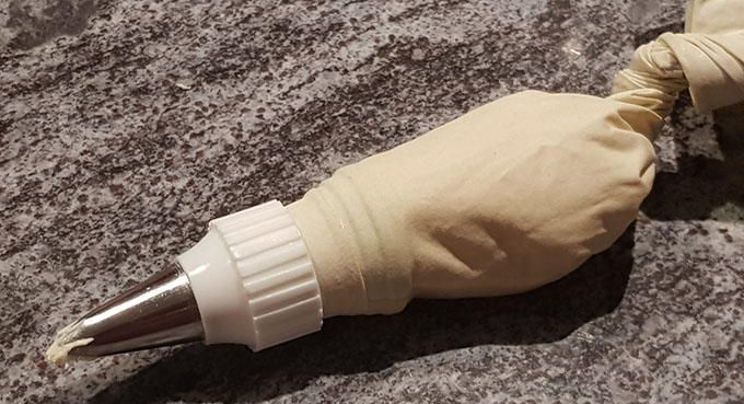 Filled piping bag